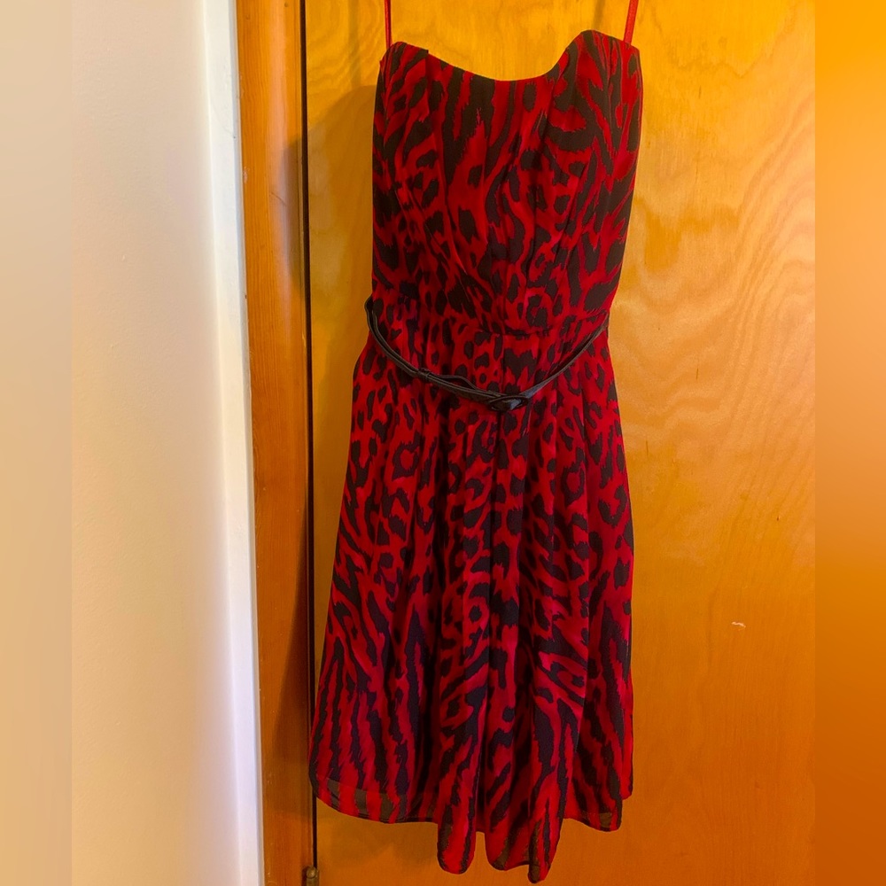 Dress was worn once! Lightweight and fun to wear. Makes a nice cocktail dress!
